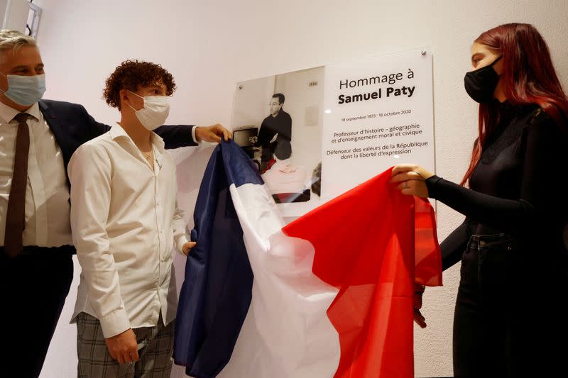 FILE PHOTO: Schoolchildren and teachers pay homage to French teacher Samuel Paty in France