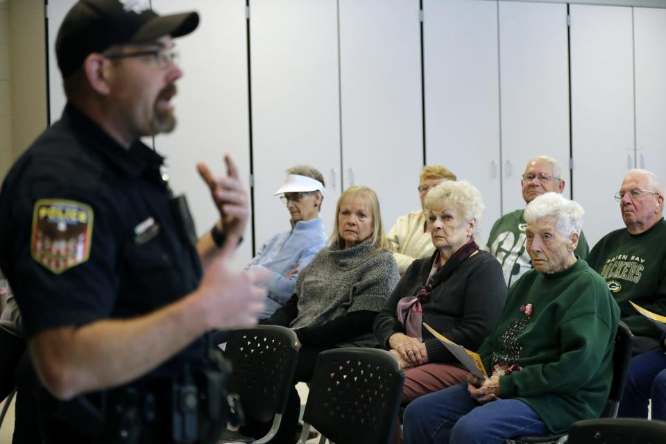 Officer Joseph Benoit, community policing coordinator, hosts a seminar teaching people about what kind of scams to look out for Thursday, Nov. 17, at Peace Lutheran Church in Neenah.