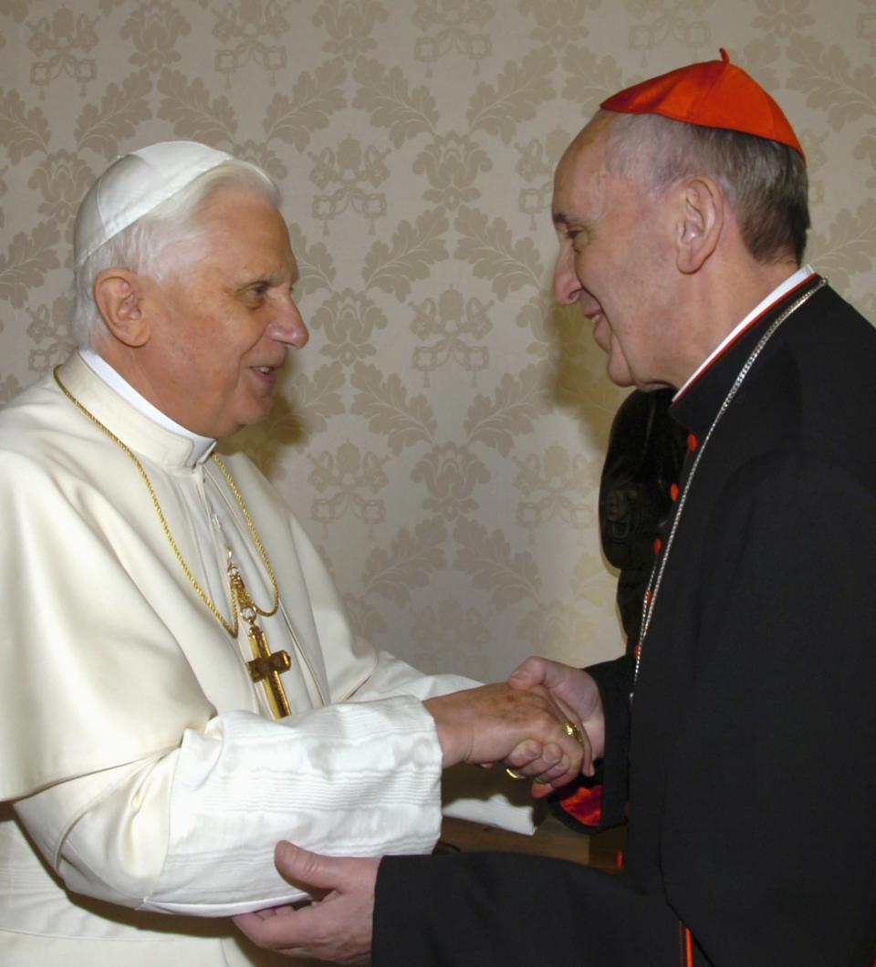 �=Pope Benedict XVI (L) greets the Archbishop of Buenos Aires Cardinal Jorge Mario Bergoglio at the Vatican, in this January 13, 2007 file photograph. Bergoglio was elected Pope to succeed Pope Benedict on March 13, 2013, and took the name of Pope Francis. REUTERS/Osservatore Romano/Files (VATICAN - Tags: RELIGION)