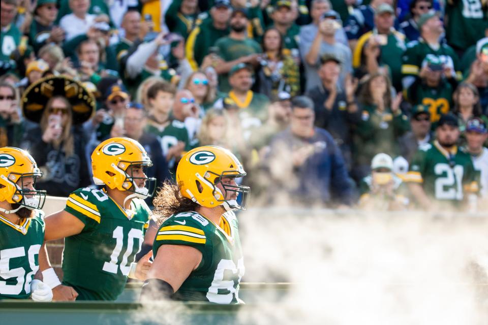 Green Bay Packers linebacker Isaiah McDuffie (58), quarterback Jordan Love (10) and Green Bay Packers offensive tackle David Bakhtiari (69) take the field before the game against New England Patriots on Sunday, Oct. 2, 2022, at Lambeau Field in Green Bay, Wis. Samantha Madar/USA TODAY NETWORK-Wis. 