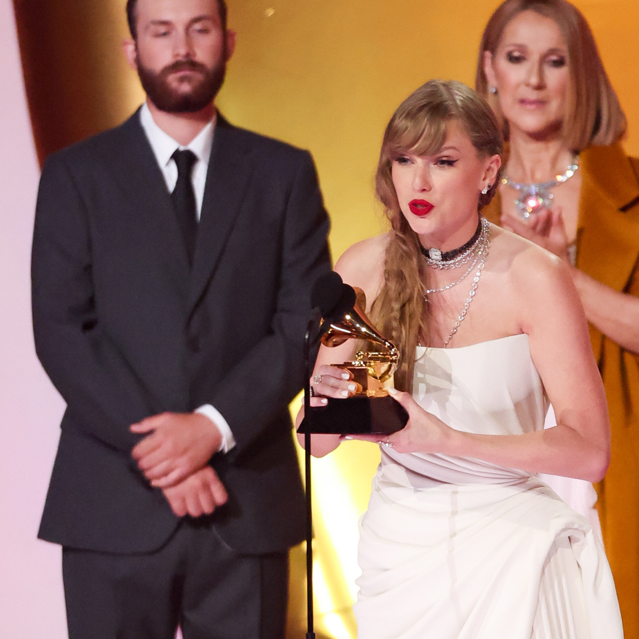  Taylor Swift accepts the Album Of The Year award for "Midnights" on stage with Celine Dion at the 66th Annual GRAMMY Awards held at Crypto.com Arena on February 4, 2024 in Los Angeles, California. 