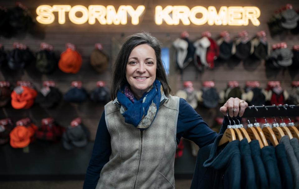 CEO of Jacquart Fabric Products, home of Stormy Kromer, Gina Jacquart Thorsen, 48, poses in the on-site retail shop of Stormy Kromer hats and other items in Ironwood on Thursday, Jan. 4, 2024. "The people are the best part of coming here," said Thorsen of her dedicated 70 employees. "It's more than a hat" she added about the passion customers have for the hats and products they sew. Her grandfather Robert Jacquart started the family fabric business in 1958 then passed it to her father and her father passed the lead to Thorsen in June 2022.