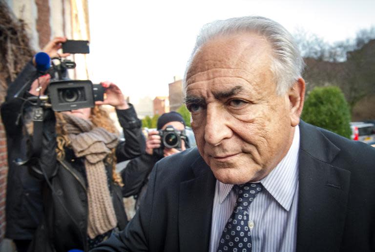 Former IMF chief Dominique Strauss-Kahn arrives to his hotel in Lille, northern France, on February 17, 2015