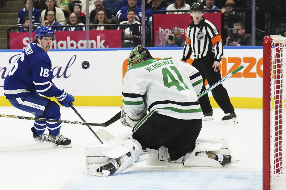 Dallas Stars goaltender Scott Wedgewood (41) stops Toronto Maple Leafs forward Mitchell Marner (16) during the second period of an NHL hockey game Wednesday, Feb. 7, 2024, in Toronto. (Nathan Denette/The Canadian Press via AP)