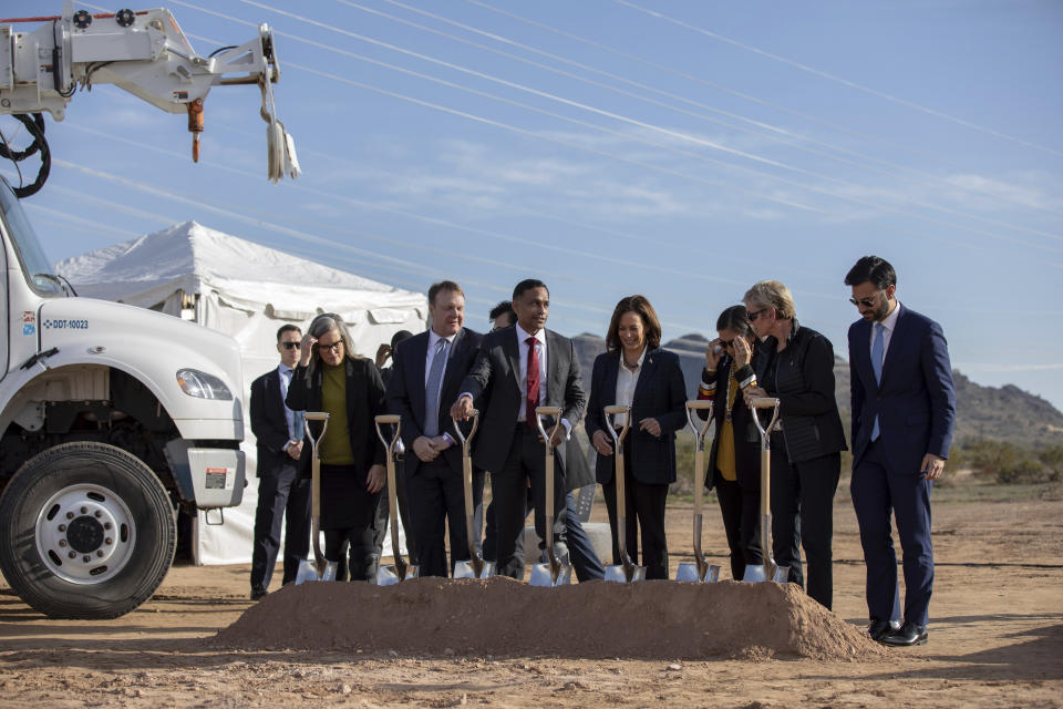 From left, Arizona Gov. Katie Hobbs, California Independent System Operator President Elliot Mainzer, Ten West Link CEO Himanshu Saxena, Vice President Kamala Harris, Interior Secretary Deb Haaland, Energy Secretary Jennifer Granholm, National Climate Advisor Ali Zaidi break ground at a ceremony for the Ten West Link transmission line, Thursday, Jan. 19, 2023, in Tonopah, Ariz. (AP Photo/Alberto Mariani)