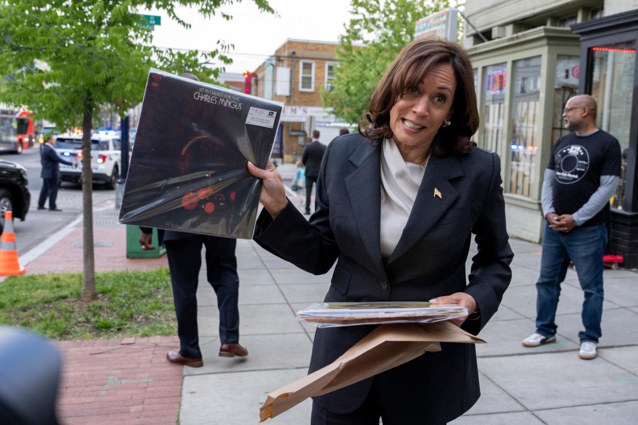 <span>Kamala Harris shows records she bought at Home Rule Record store in Washington DC last year.</span><span>Photograph: Ken Cedeno/EPA</span>