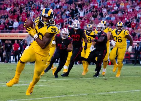Sep 21, 2017; Santa Clara, CA, USA; Los Angeles Rams running back Todd Gurley (30) runs for a touchdown against the San Francisco 49ers during the first quarter at Levi's Stadium. Mandatory Credit: Kelley L Cox-USA TODAY Sports