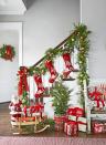 <p>This banister greenery in the entryway gets a touch of sparkle with 1950s favorites like Shiny Brite ornaments. Other vintage touches (the sled, Santa, and tin for the mini potted tree) add a sense of nostalgia.</p><p><a class="link " href="https://www.amazon.com/s?k=santa+blow+molds&tag=syn-yahoo-20&ascsubtag=%5Bartid%7C10050.g.23362967%5Bsrc%7Cyahoo-us" rel="nofollow noopener" target="_blank" data-ylk="slk:SHOP SANTA BLOW MOLDS;elm:context_link;itc:0;sec:content-canvas">SHOP SANTA BLOW MOLDS</a></p>