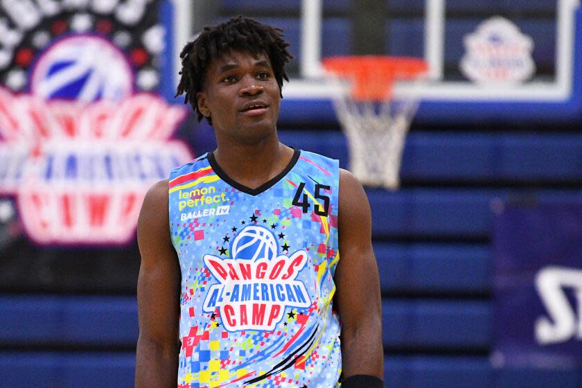 Tounde Yessoufou stands on the court and looks up during the Pangos All-American Camp in Las Vegas