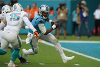 Miami Dolphins outside linebacker Jaelan Phillips (15) runs to sack Carolina Panthers quarterback Cam Newton (1) during the second half of an NFL football game, Sunday, Nov. 28, 2021, in Miami Gardens, Fla. (AP Photo/Lynne Sladky)