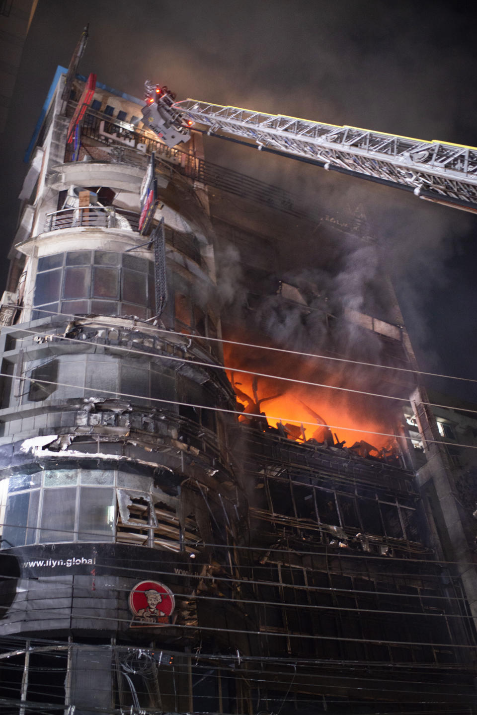 Firefighters work to contain a fire that broke out at a commercial complex in Dhaka, Bangladesh, Thursday, Feb. 29, 2024. Bangladesh's health minister says a fire in a six-story commercial complex in the nation's capital, Dhaka, has killed several people and injured dozens of others. (AP Photo/Mahmud Hossain Opu)