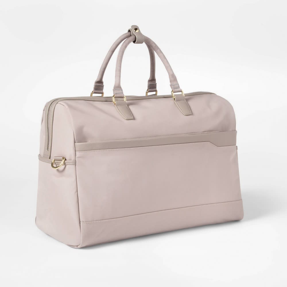 <p><a href="https://go.redirectingat.com?id=74968X1596630&url=https%3A%2F%2Fwww.target.com%2Fp%2Fsignature-weekender-bag-taupe-open-story-8482%2F-%2FA-77377090&sref=https%3A%2F%2Fwww.veranda.com%2Fshopping%2Fg60333759%2Fbest-travel-tote-bags%2F" rel="nofollow noopener" target="_blank" data-ylk="slk:Shop Now;elm:context_link;itc:0;sec:content-canvas" class="link rapid-noclick-resp">Shop Now</a></p><p>Signature Weekender Bag</p><p>target.com</p><p>$79.99</p>