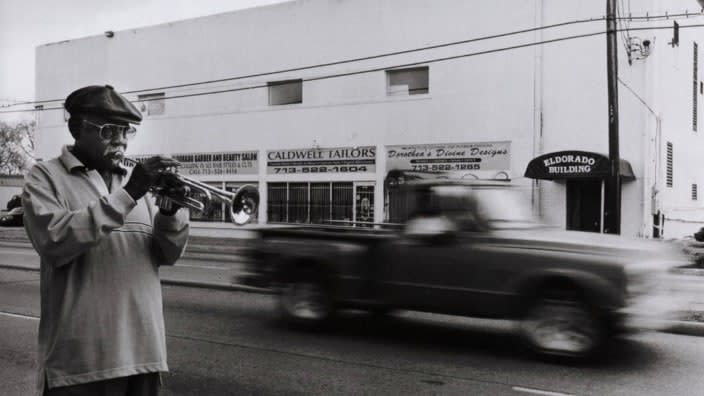 This May 2000 photo shows trumpeter Calvin Owens performing in the street at Emancipation Park, which is located opposite famous Houston music venue The Eldorado Ballroom. (Photo: James Fraher/Redferns)