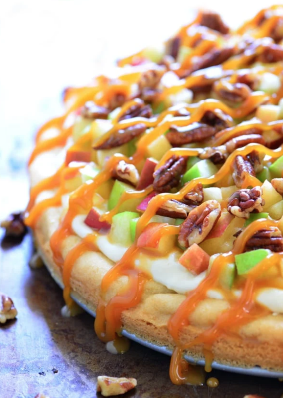 <p>Gunny Sack</p><p>This caramel apple fruit pizza is a delicious fall dessert with a sugar cookie crust, cream cheese frosting, toasted pecans and a drizzle of caramel. </p><p><strong>Get the recipe: <em><a href="https://www.thegunnysack.com/caramel-apple-fruit-pizza" rel="nofollow noopener" target="_blank" data-ylk="slk:Caramel Apple Fruit Pizza;elm:context_link;itc:0;sec:content-canvas" class="link ">Caramel Apple Fruit Pizza</a></em></strong></p>