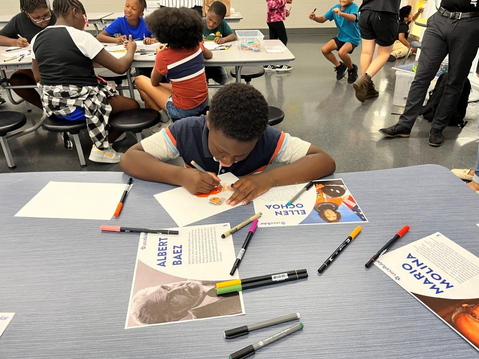 Adam Jones is hard at work on a portrait of a Hispanic STEM icon at the kickoff event for the first Hispanic Heritage Art Contest, sponsored by UScellular, at the Lonsdale location of the Boys & Girls Club of the Tennessee Valley. Aug. 31, 2023