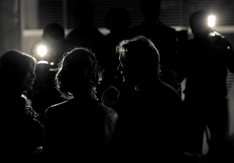 DUBAI, UNITED ARAB EMIRATES - DECEMBER 14: (EDITORS NOTE: Image has been converted to black and white) Actor Colin Firth with his wife Livia attend the 2012 Dubai International Film Festival, Dubai Cares and Oxfam "One Night to Change Lives" Charity Gala at the Armani Hotel on December 14, 2012 in Dubai, United Arab Emirates. (Photo by Gareth Cattermole/Getty Images for DIFF)