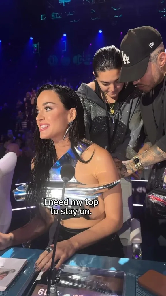 Perry received some help with her top during the show. @katyperry/Instagram