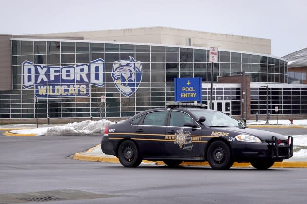A police vehicle remains parked outside of Oxford High School on December 01, 2021 in Oxford, Michigan. Yesterday, three students were killed and eight others were injured when a gunman began shooting at the school. A 15-year-old sophomore, believed to be the only gunman, is in custody. - Credit: Scott Olson/Getty Images