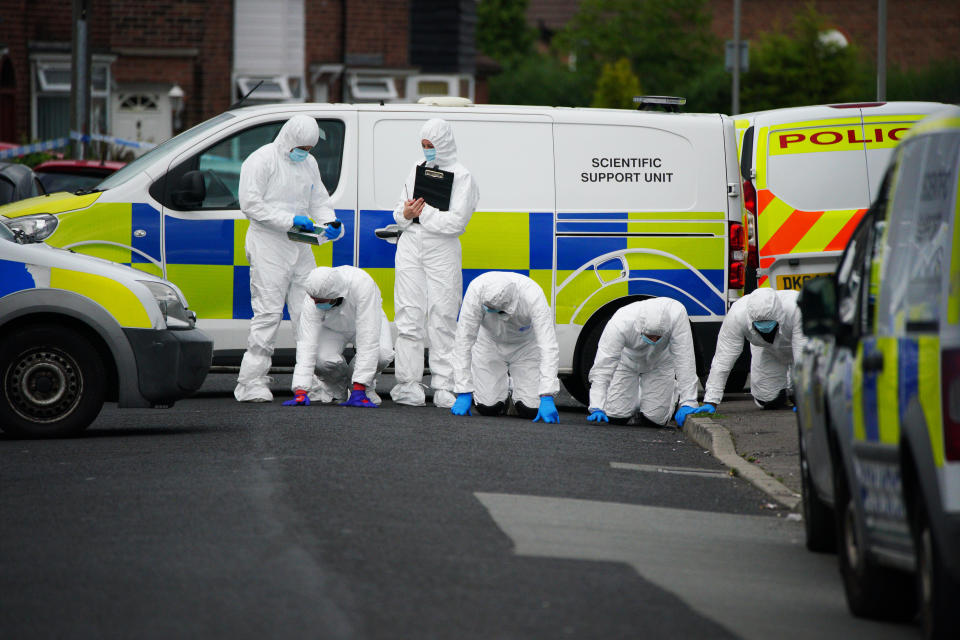 Forensic officers near to the scene in Kingsheath Avenue, Knotty Ash, Liverpool, where a nine-year-old girl has been fatally shot. Officers from Merseyside Police have started a murder investigation after attending a house at 10pm Monday following reports that an unknown male had fired a gun inside the property. Picture date: Tuesday August 23, 2022.