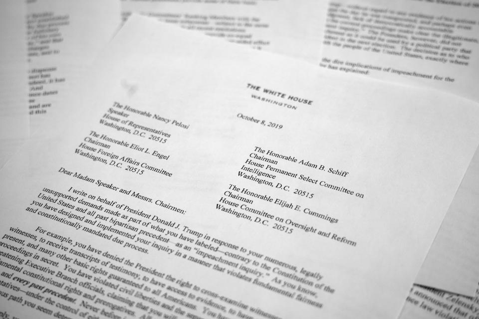 A letter from White House counsel Pat Cipollone is photographed in Washington, on Tuesday, Oct. 8, 2019. The White House declared it will not cooperate with what it termed the "illegitimate" impeachment probe by House Democrats, sharpening the constitutional clash between President Donald Trump and Congress. Trump attorneys sent a letter to House leaders bluntly stating their refusal to participate in the quickly moving impeachment investigation. (AP Photo/Jon Elswick)