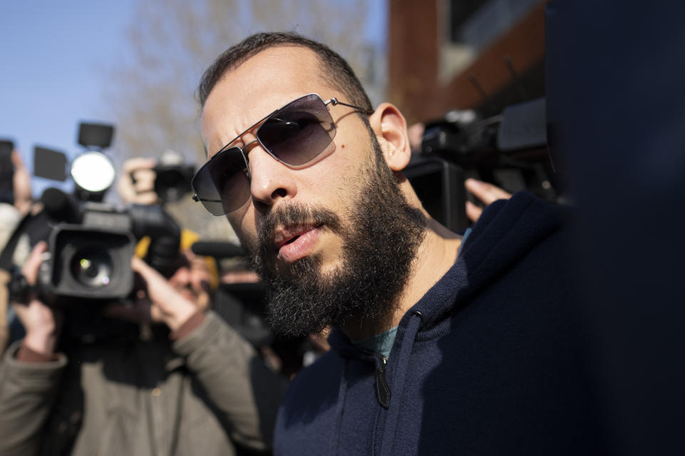 Andrew Tate leaves the Directorate for Investigating Organized Crime and Terrorism (DIICOT) where prosecutors examined electronic equipment confiscated during the investigation into his case, in Bucharest, Romania, Monday, April 10, 2023. (AP Photo/Vadim Ghirda)