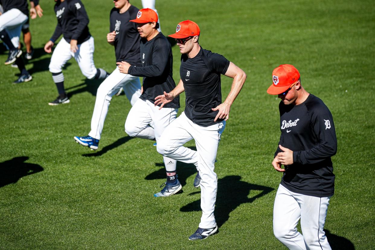 Detroit Tigers players, including outfielder Mark Canha, work out during spring training at Joker Marchant Stadium in Lakeland, Florida, on Thursday, Feb. 22, 2024.