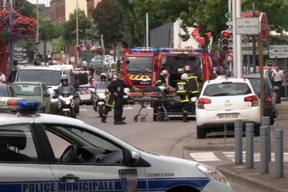 <p>In this grab made from video, emergency services transport a person into a waiting ambulance in Normandy, France, Tuesday, July 26, 2016. (BFM via AP)</p>