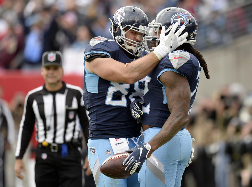 Tennessee Titans running back Derrick Henry, right, is congratulated by tight end Luke Stocker (88) after Henry scored a touchdown against the New England Patriots in the first half of an NFL football game Sunday, Nov. 11, 2018, in Nashville, Tenn. (AP Photo/Mark Zaleski)