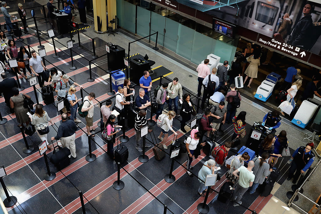 Passengers move through Transportation Security Administration screening points and from terminal to terminal at Ronald Reagan National Airport May 27, 2016 in Arlington, VA.