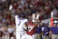 Oklahoma wide receiver Marvin Mims (17) and TCU safety T.J. Carter (7) look for a pass during the first half of an NCAA college football game Saturday, Oct. 16, 2021, in Norman, Okla. (AP Photo/Alonzo Adams)