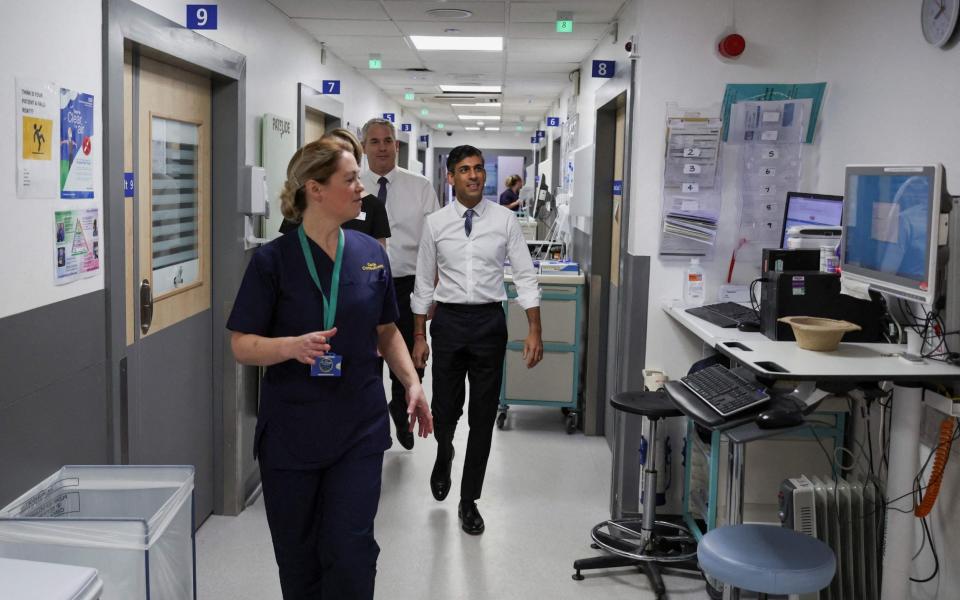 Rishi Sunak, the Prime Minister, is pictured this morning during a visit to the University Hospital of North Tees in Stockton-on-Tees - Phil Noble/AFP