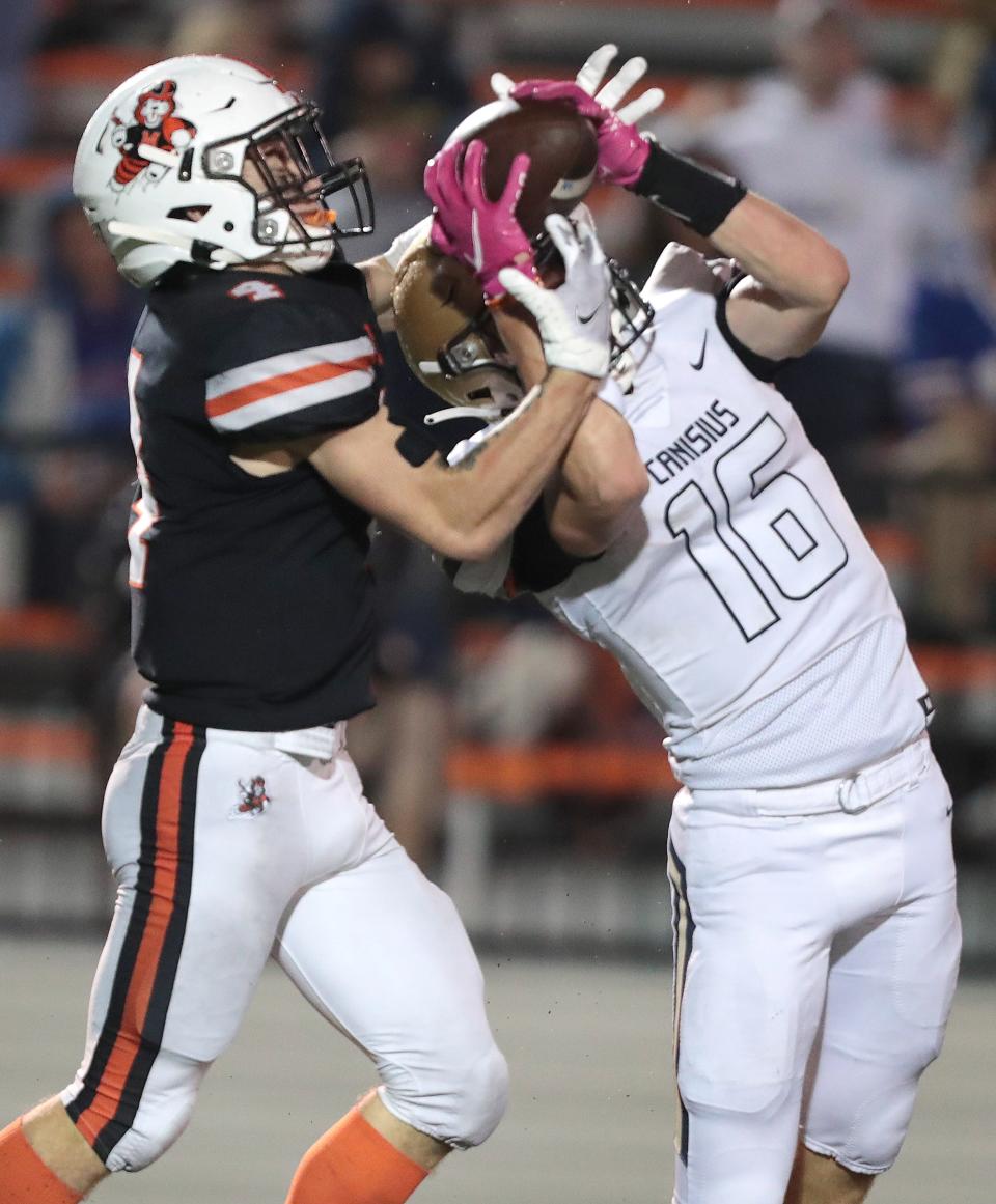 Massillon's Austin Brawley comes away with the reception over Canisius New York's Josh Fillion which Brawley ran in for a second quarter touchdown at Massillon.