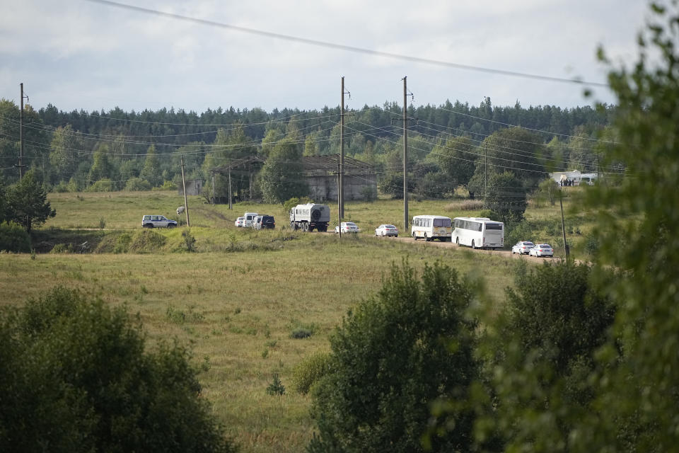 A convoy of vehicles move towards a point of a private jet crash, near the village of Kuzhenkino, Tver region, Russia, Thursday, Aug. 24, 2023. Russian mercenary leader Yevgeny V. Prigozhin, the founder of the Wagner Group, reportedly died when a private jet he was said to be on crashed on Aug. 23, 2023, killing all 10 people on board. (AP Photo/Alexander Zemlianichenko)