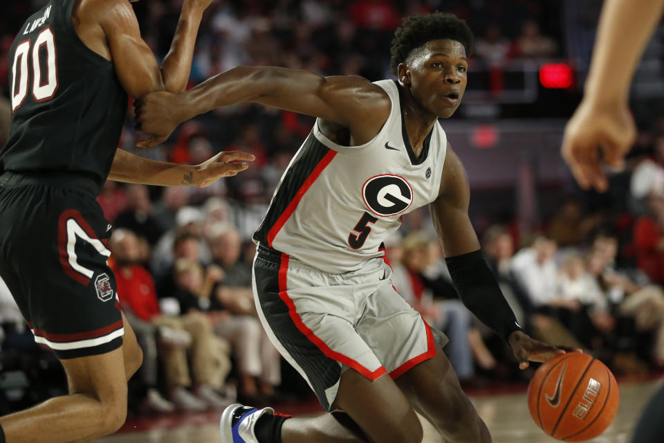 Georgia's Anthony Edwards (5) is defended by South Carolina's AJ Lawson during an NCAA college basketball game Wednesday, Feb. 12, 2020, in Athens, Ga. (Joshua L. Jones/Athens Banner-Herald via AP)