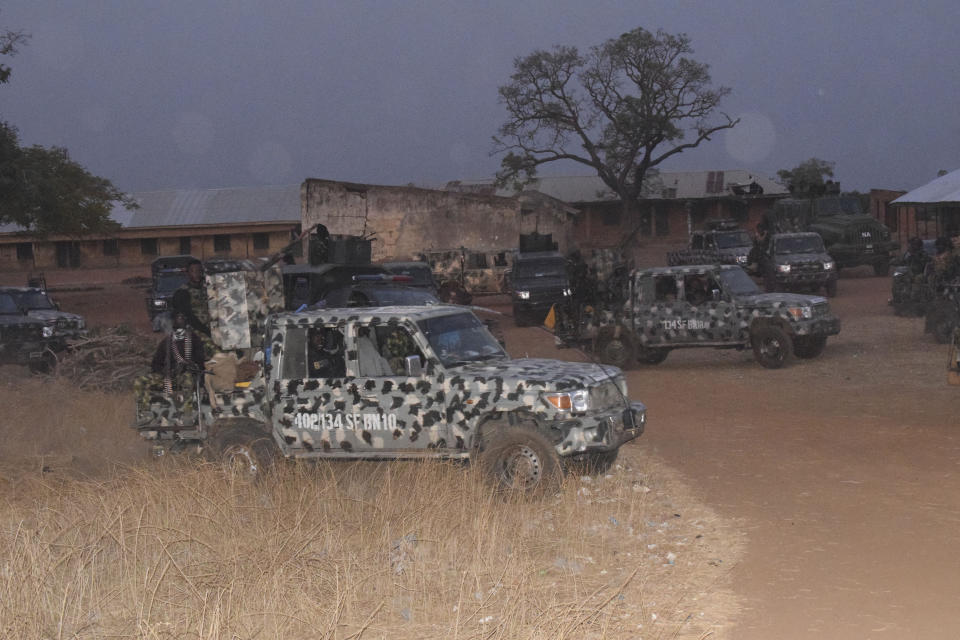 Nigerian Army trucks are parked at the school were children were kidnapped in Chikun, Nigeria, Thursday, March 7, 2024. Gunmen attacked a school in Nigeria's northwest region Thursday morning and abducted at least 287 students, the headteacher told authorities, marking the second mass abduction in the West African nation in less than a week. (AP Photo)