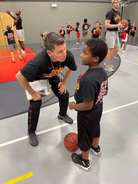 Crossfire Ministries' co-founder Jamie Johnson talks with a camper during the Hendersonville First Baptist Church camp.