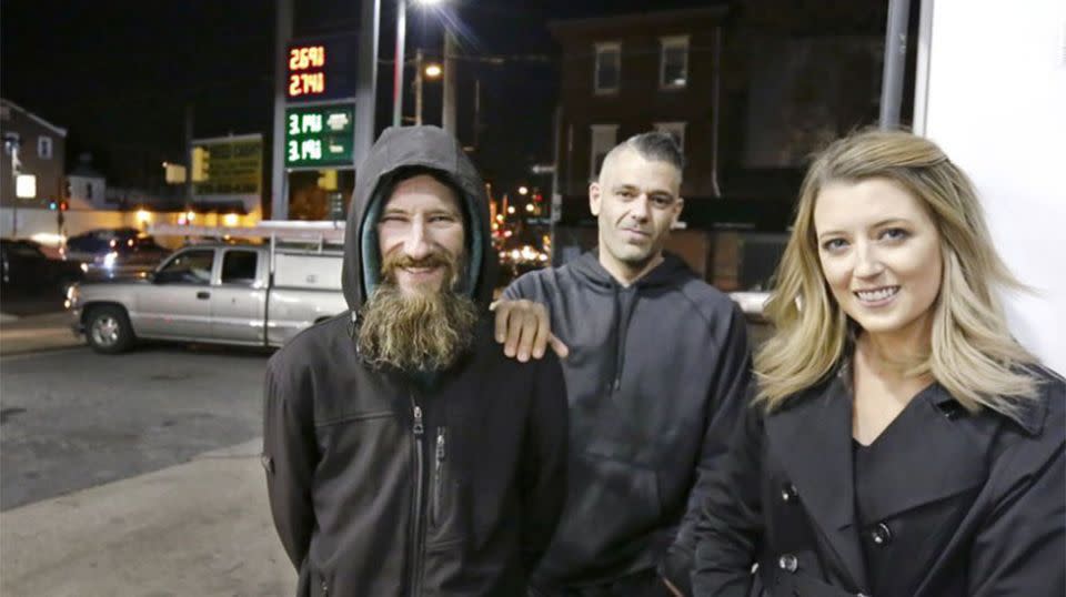 Johnny Bobbitt Jr, left, Kate McClure, right, and McClure's boyfriend Mark D'Amico pose at a Citgo station in Philadelphia. Source: AP