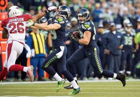 Nov 23, 2014; Seattle, WA, USA; Seattle Seahawks tight end Luke Willson (82) carries the ball against the Arizona Cardinals during the second half at CenturyLink Field. Seattle defeated Arizona 19-3. Mandatory Credit: Steven Bisig-USA TODAY Sports