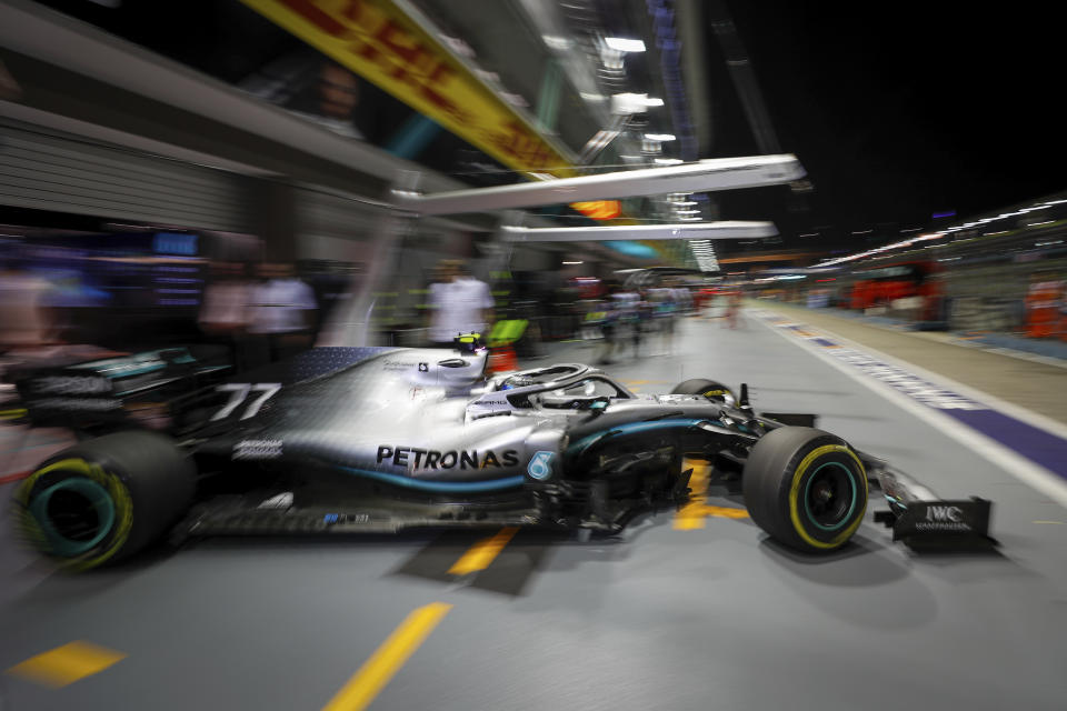 Mercedes driver Valtteri Bottas of Finland pulls out of his garage during the second practice session at the Marina Bay City Circuit ahead of the Singapore Formula One Grand Prix in Singapore, Friday, Sept. 20, 2019. (AP Photo/Vincent Thian)