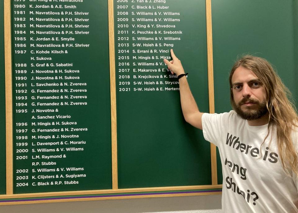 Jason Leith from the Free Tibet group in front of the Wimbledon honours board (Rebecca Speare-Cole/PA) (PA Wire)