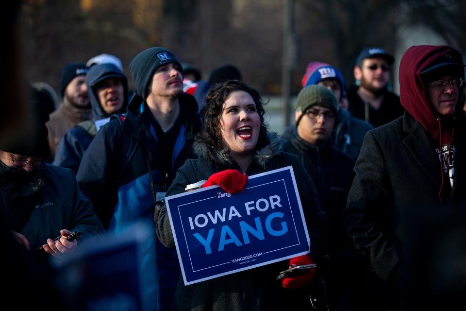 A supporter of Andrew Yang, Democratic presidential candidate, cheers during a rally to kick-off his bus tour across the state on Tuesday, Dec. 10, 2019, on the steps of the Iowa State Capitol.  