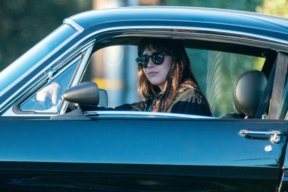 <p>Dakota Johnson hits the brakes on Saturday while out for a drive in Malibu.</p>