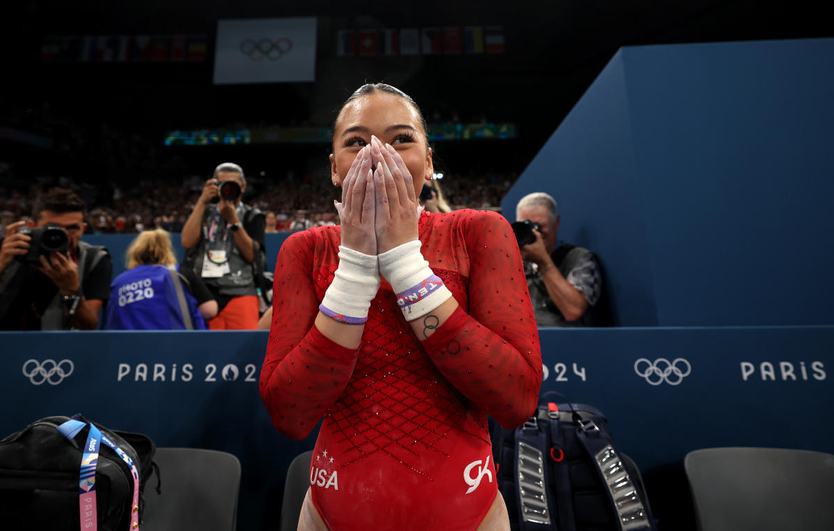 Olympic gymnastics Sunisa Lee — proud to be a Hmong American — grabs