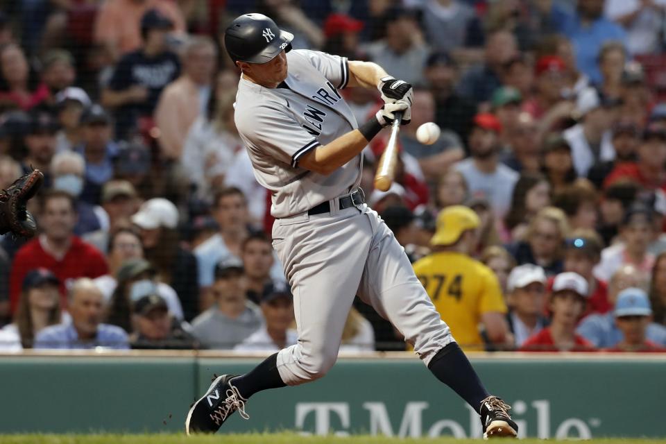 New York Yankees' DJ LeMahieu hits a two-run single during the second inning of a baseball game against the Boston Red Sox, Friday, June 25, 2021, in Boston. (AP Photo/Michael Dwyer)