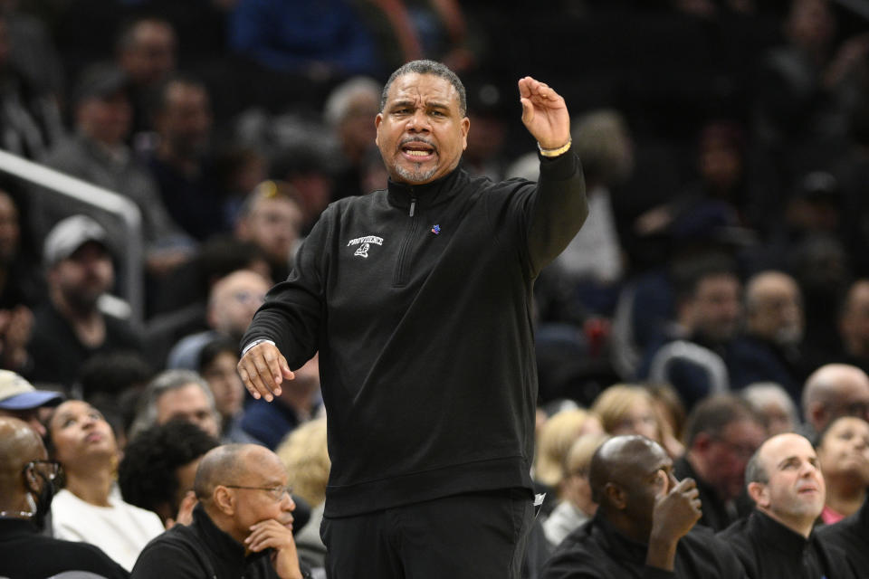 FILE - Providence head coach Ed Cooley gestures during the second half of an NCAA college basketball game against Georgetown, Sunday, Feb. 26, 2023, in Washington. Ed Cooley is the new men’s basketball coach at Georgetown, hired away from Big East rival Providence in the hopes of rebuilding a once-proud program that dropped to new lows under former star player Patrick Ewing. Georgetown announced the move on Monday, March 20, 2023, after Providence issued a news release saying that Cooley had resigned. (AP Photo/Nick Wass, File)