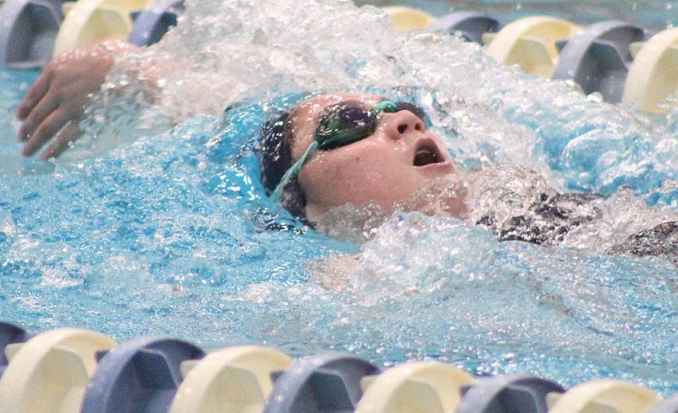Lily Talbot tears through the water during a Bartlesville High School swimming competition earlier in her prep career.