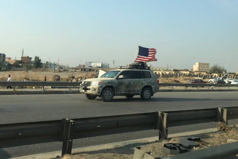 A U.S vehicle is seen driving on a street in Dohuk