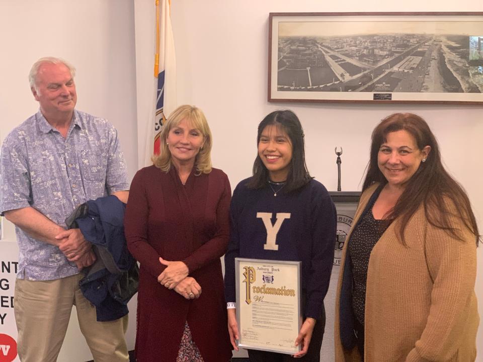 Dayra Meija-Reyes accepts her proclamation from the Asbury Park city council on April 27, 2022. The Sisters Academy alum will attend Yale in the fall. From left to right; her teacher Kevin Kelly, Mercy Center Executive Director Kim Guadagno, Dayra Meija-Reyes, Principal Elena Malinconico
