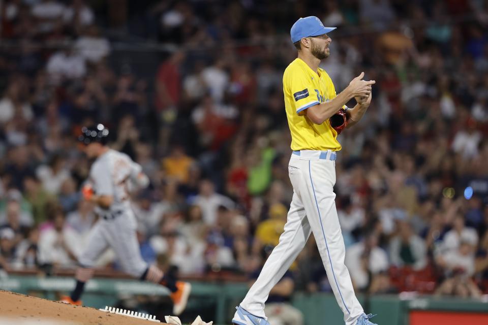 Boston Red Sox starting pitcher Chris Sale walks off the mound after giving up a solo home run to Detroit Tigers' Kerry Carpenter, left, during the fifth inning of a baseball game Friday, Aug. 11, 2023, in Boston. (AP Photo/Michael Dwyer)