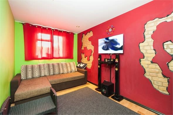 The red and green living room.